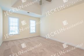 Glen Allen house for rent - a master bedroom with two windows and beige carpet