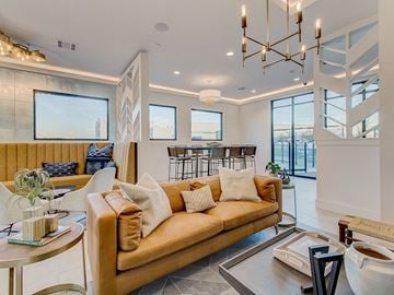 Fort Worth apartment for rent - a living room with a yellow couch and a table
