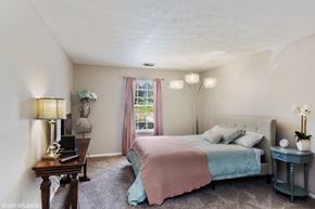 Cincinnati apartment for rent - a bedroom with a bed and a desk and a window at Brookstone Village, Cincinnati