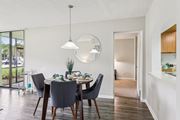 Melbourne apartment for rent - A dining room with a table set for two and a large window. at Lakeside Glen Apartments, Florida, 32904