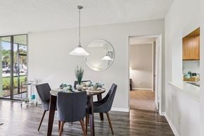 Melbourne apartment for rent - A dining room with a table set for two and a large window. at Lakeside Glen Apartments, Florida, 32904