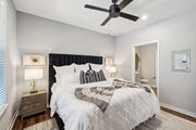 Stuart apartment for rent - A bedroom with a large bed and a ceiling fan at AxisOne Apartment , Stuart, Florida
