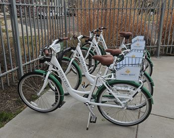Three bicycles are parked next to each other