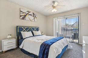 Dallas apartment for rent - a bedroom with a bed and a ceiling fan at The Glen at Highpoint, Dallas, 75243