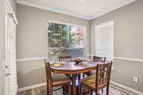 Greensboro apartment for rent - A dining room with a table set for four. at Bridford Lake Apartments, Greensboro