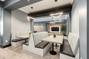 Stuart apartment for rent - A modern dining area with a long table and chairs at AxisOne Apartment , Stuart, Florida