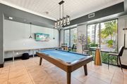 Stuart apartment for rent - A pool table in a room with a painting on the wall at AxisOne Apartment, Stuart, FL, 34994