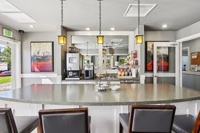 Broomfield apartment for rent - A kitchen with a table and chairs in front of it. at Deer Crest Apartments, Broomfield, 80020