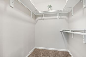 A small room with white walls and a carpeted floor