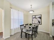 Raleigh apartment for rent - A dining room with a table set for four. at Cedar Springs Apartments, Raleigh, NC