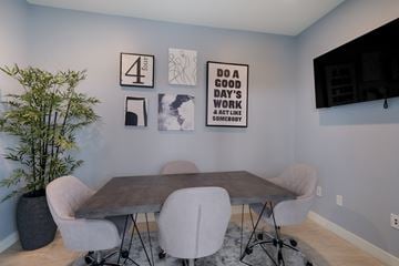 Philadelphia apartment for rent - a dining room with a table and chairs and artwork on the wall