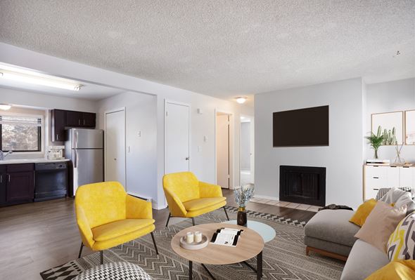 Fort Collins apartment for rent - Living room with yellow chairs and a table at Governor's Park, Fort Collins, 80525