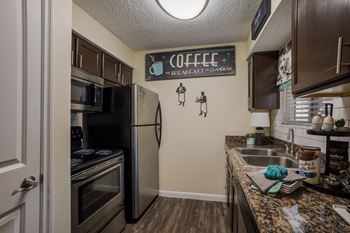 Kitchen with stainless steel appliances and a granite counter top  
