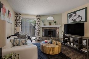 Albuquerque apartment for rent - Living room with fireplace at Mountain Run Apartments, New Mexico, 87111