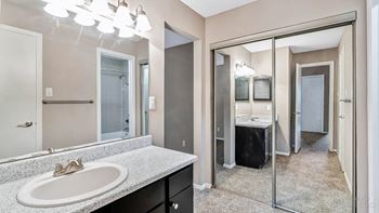 Bathroom with vanity and closet