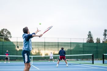 Man hitting a tennis ball