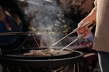 Person grilling food