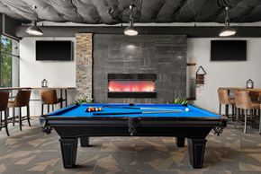Tacoma apartment for rent - a games room with a pool table and a fireplace