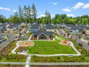 Gig Harbor apartment for rent - A park with a playground and a slide in the middle of a residential area.