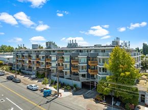 Tacoma apartment for rent - a large apartment building with many balconies and a street in front of it