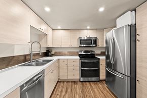 Lacey apartment for rent - a modern kitchen with stainless steel appliances and white counter tops