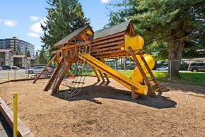 Olympia apartment for rent - a playground at a park with a yellow swing set