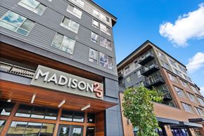 Tacoma apartment for rent - a building with a madison 2 sign on the side of it