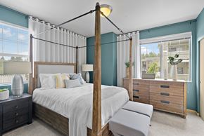 Edgewood apartment for rent - a bedroom with a bed and a dresser and a window