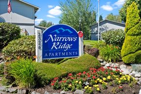 University Place apartment for rent - the sign for narrowness ridge apartments in front of a flower garden