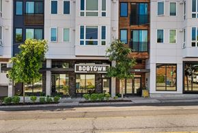 Seattle apartment for rent - A white building with the name BOOSTOWN on the front.