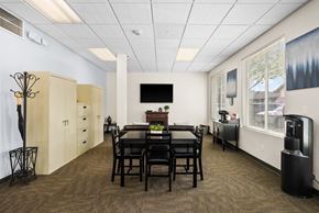 Gig Harbor apartment for rent - a dining room with a table and chairs in front of a large window