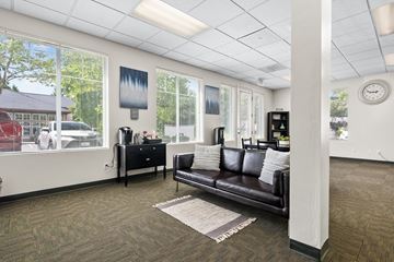 Gig Harbor apartment for rent - a living room with a leather couch and a window