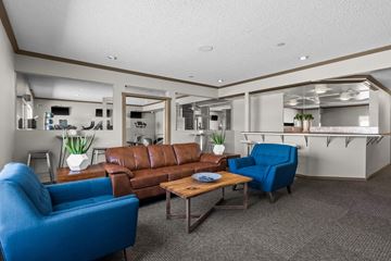 Tumwater apartment for rent - a living room with couches and chairs and a kitchen