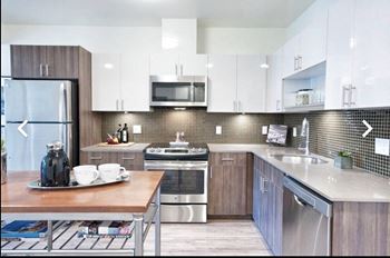 Quartz countertops with tile backsplash