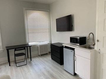 San Francisco apartment for rent - a small kitchen with a microwave and a table