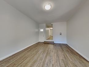 San Francisco apartment for rent - a spacious living room with white walls and wood floors