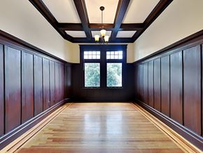 San Francisco apartment for rent - A long hallway with wooden floors and dark wood paneling on the walls.
