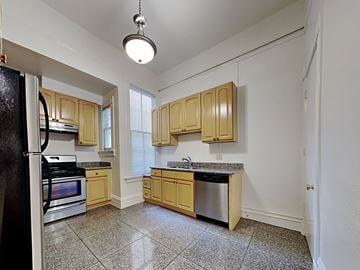 San Francisco apartment for rent - a kitchen with wooden cabinets and stainless steel appliances
