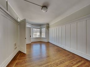 San Francisco apartment for rent - a living room with white walls and wood floors