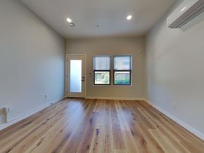 San Francisco apartment for rent - an empty living room with hardwood floors and a window