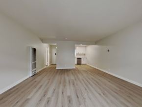 Oakland apartment for rent - a living room with wood floors and white walls