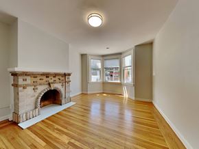 San Francisco apartment for rent - a living room with a fireplace and a hard wood floor