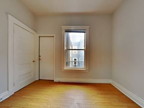 San Francisco apartment for rent - a bedroom with a window and a door and a wooden floor