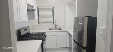 San Francisco apartment for rent - a small kitchen with a stove and a refrigerator