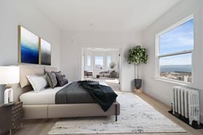 San Francisco apartment for rent - a bedroom with a bed and two large windows