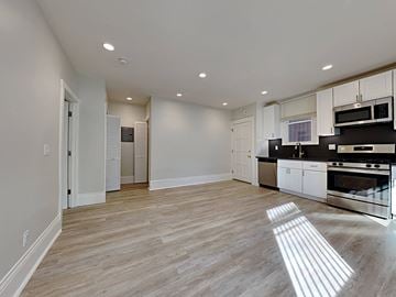 San Francisco apartment for rent - an open kitchen and living room with a hard wood floor