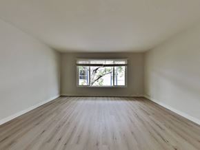 Oakland apartment for rent - an empty room with wooden floors and a window