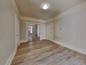 San Francisco apartment for rent - a living room with white walls and a wooden floor