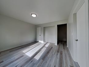 San Francisco apartment for rent - a renovated living room with wood floors and white walls