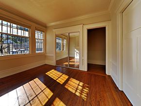 San Francisco apartment for rent - an empty living room with sunlight coming through a window